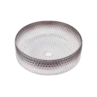 A vaidade redonda do banheiro rola claro e a borda preta chanfrada drena o furo