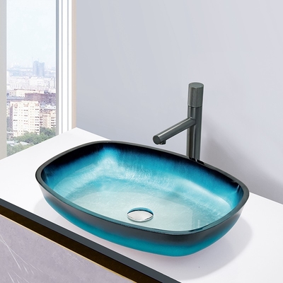 O azul de vidro do inclinação moderou a bancada do tampo da mesa da forma do melão das bacias de lavagem do banho montada
